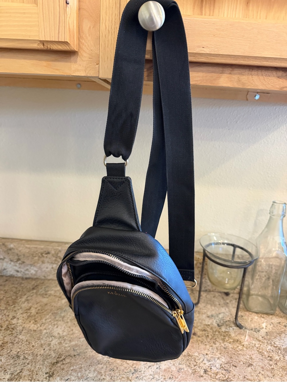 Black Leather Sling Bag with Gold Zippers